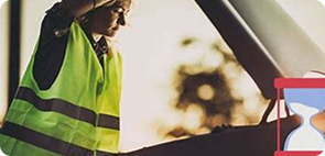 Worker next to a broken vehicle